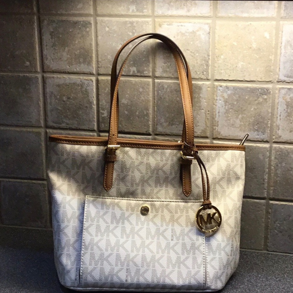 MICHAEL KORS white and brown tote bag.